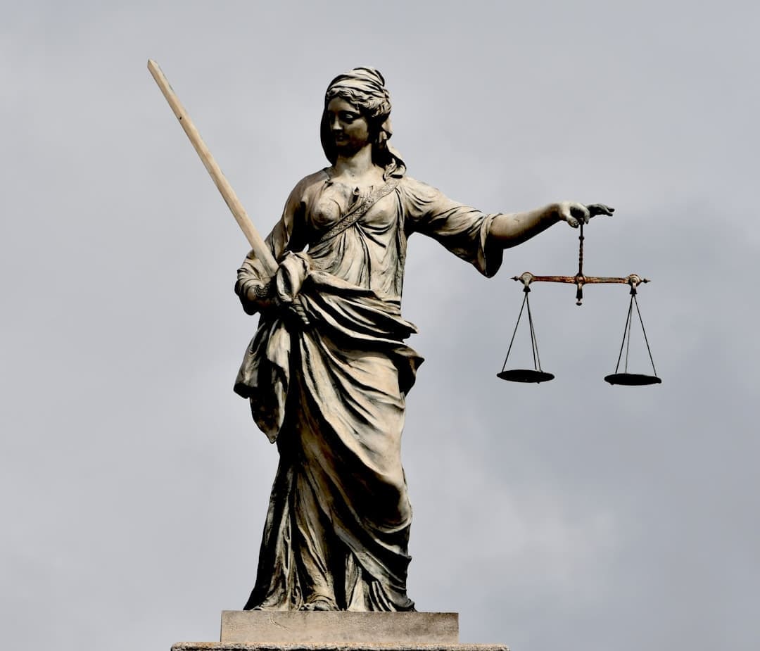 california support animal — A statue of lady justice holding a sword and a scale