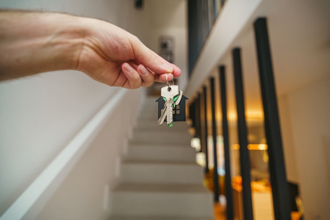 support animal accommodation — Here's a possible caption: keys being held in front of a staircase.