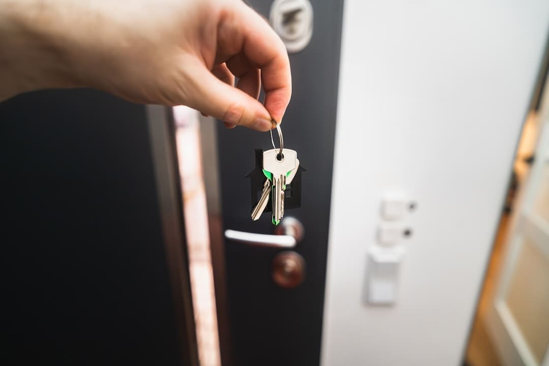 reasonable accommodation — A person is holding a key to a door