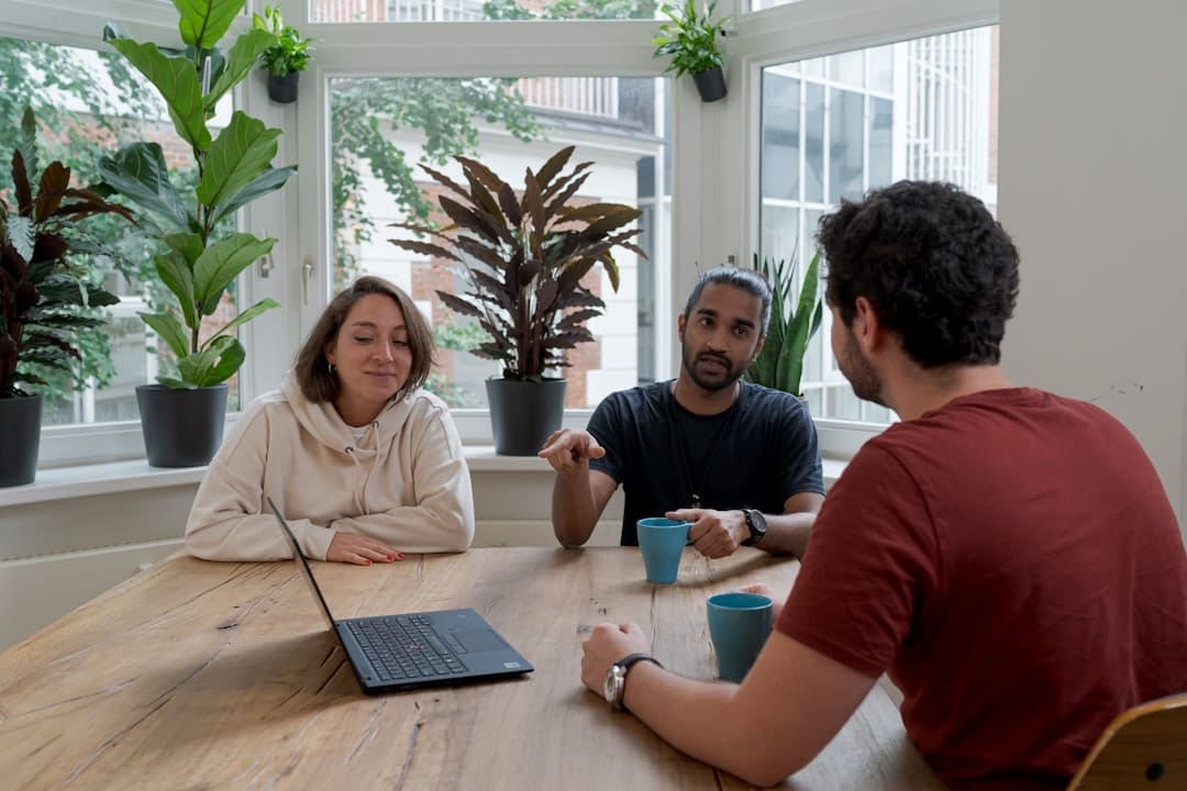 support animal accommodation — woman in white hijab sitting beside man in red crew neck t-shirt