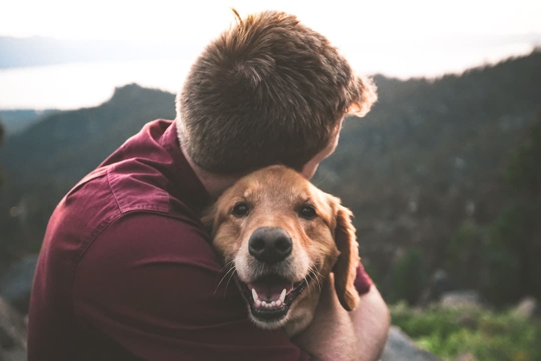 support animals and anxiety — photo of man hugging tan dog
