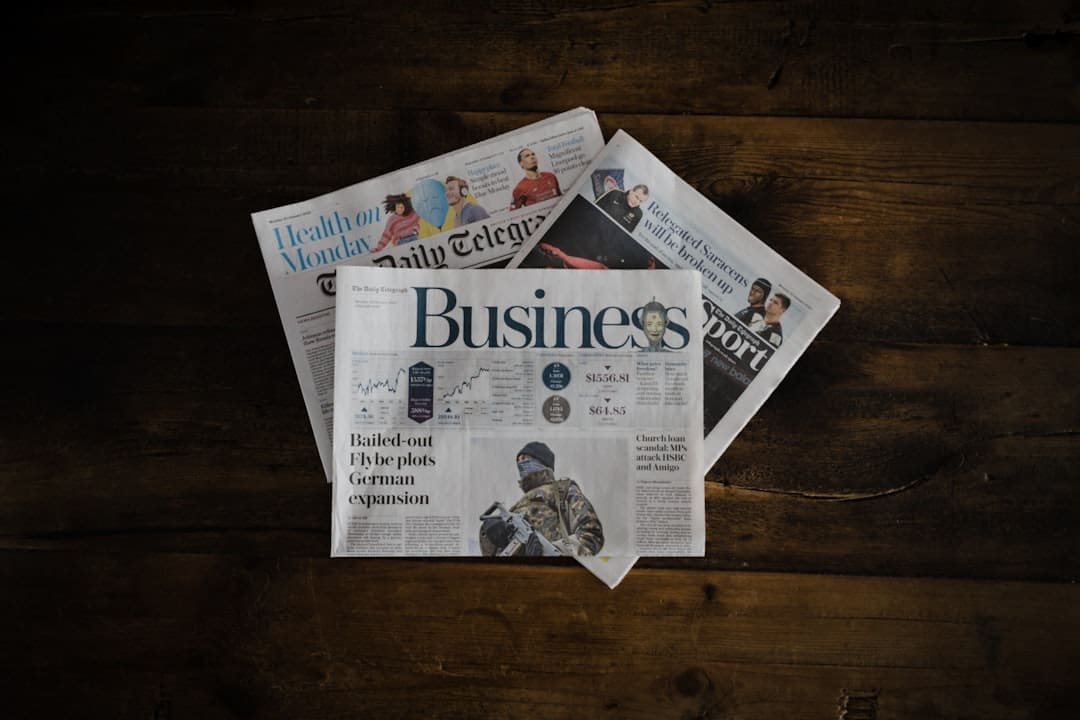 ADA update 2026 — a stack of newspapers sitting on top of a wooden table